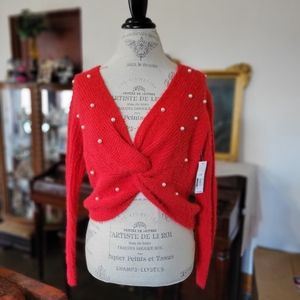 Soft and fuzzy cropped sweater with pearls.